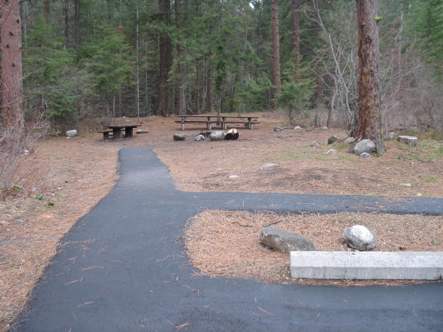 picture showing Charles Waters Campground: Picture is of the the group campsite. Only part of this site is accessible. The paved path into the site abruptly ends, leaving a tread obstacle of about 2 inches.